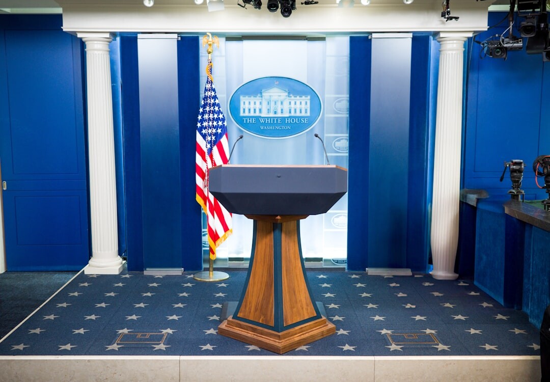 Journalists and camera operators working in a press briefing room
