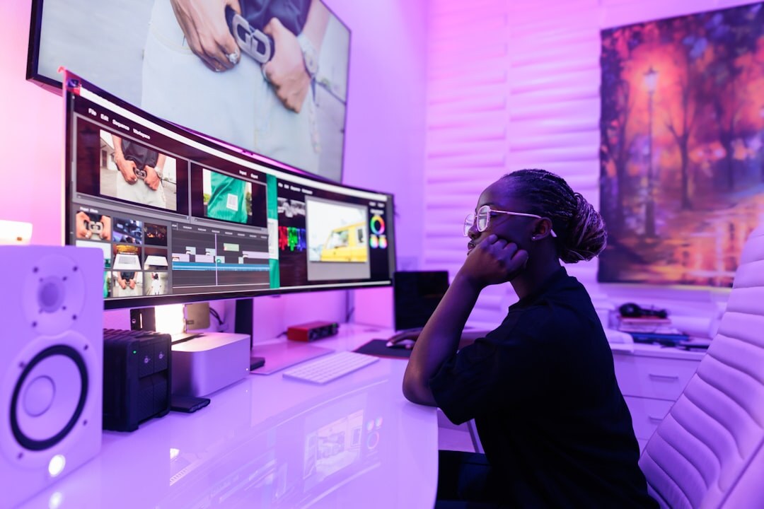 Editors reviewing video footage on multiple monitors