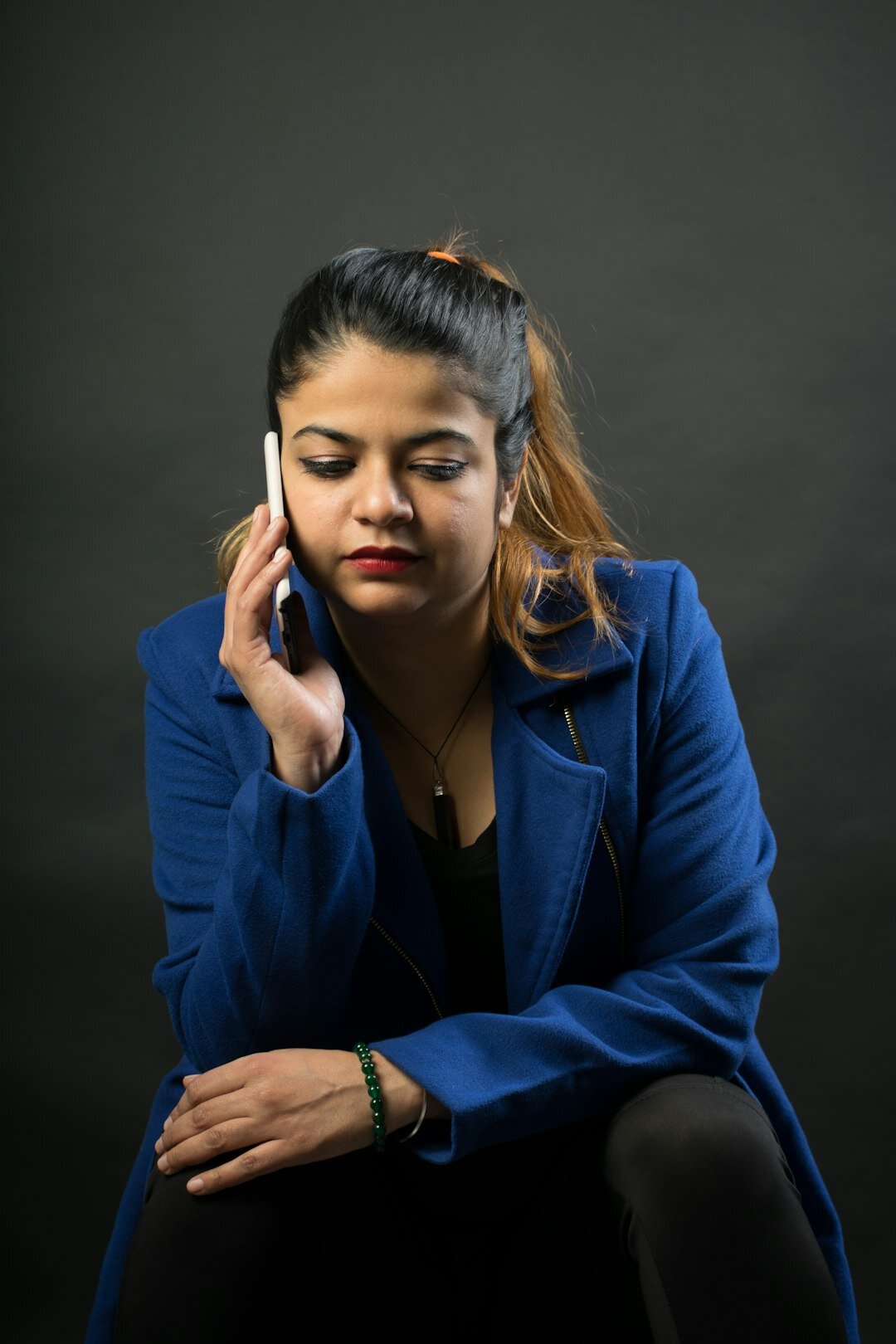 Studio portrait of a professional woman with a headset